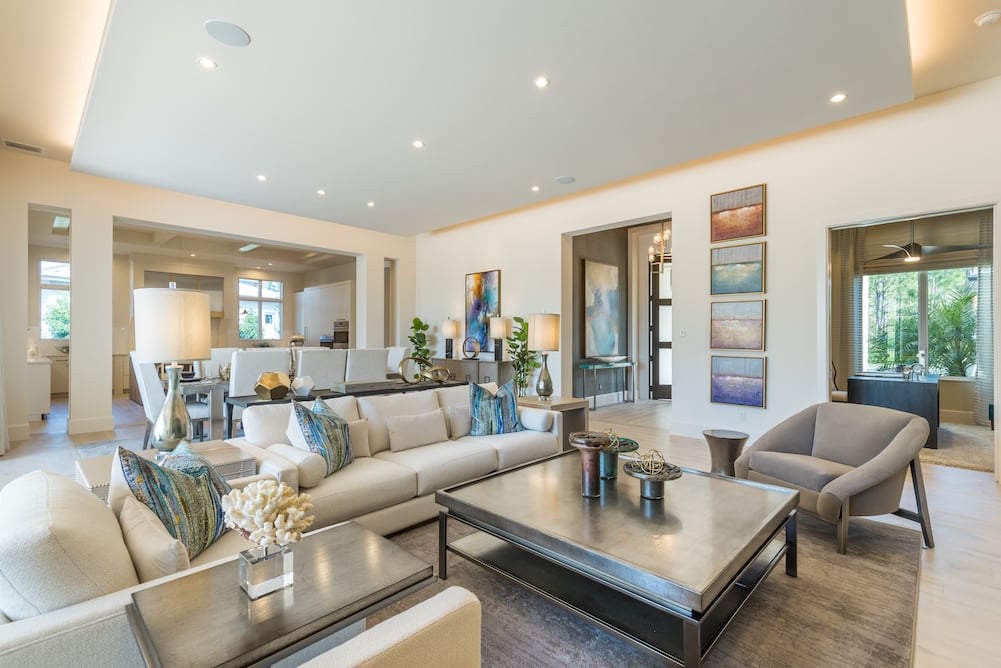 living room with white couch and large coffee table of coastal home