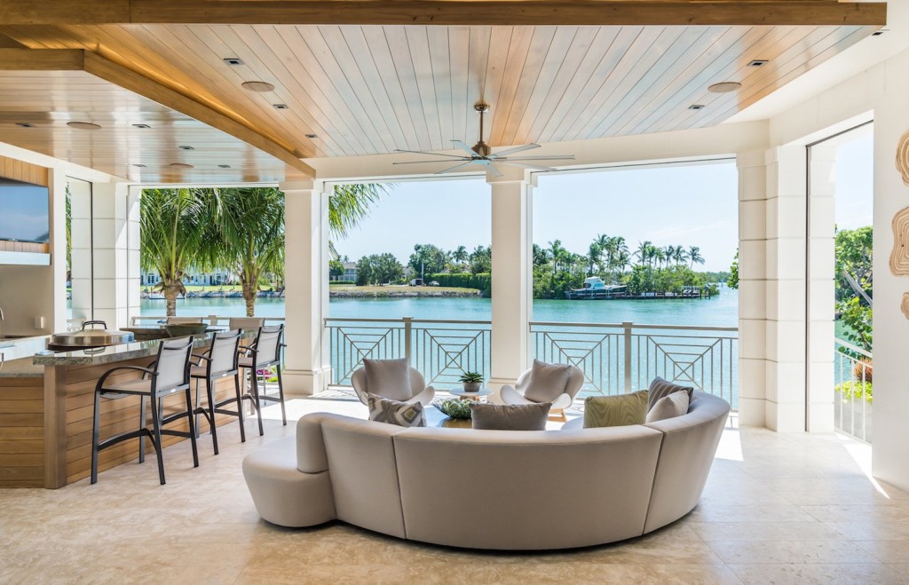 The luxury estate home located at 4395 Gordon Drive features a stunning outdoor living space to match the view