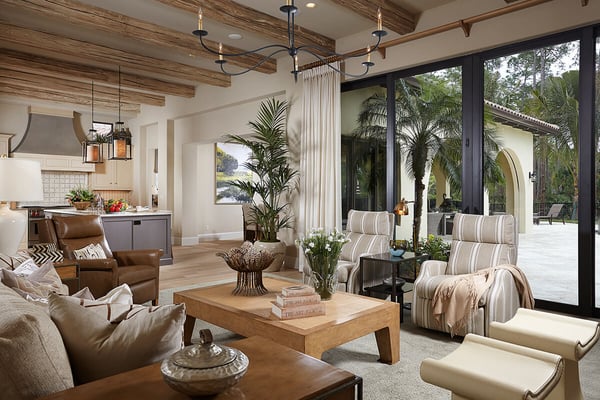 Use varying heights to add visual interest, as seen on this coffee table in a Mediterra Naples custom home.