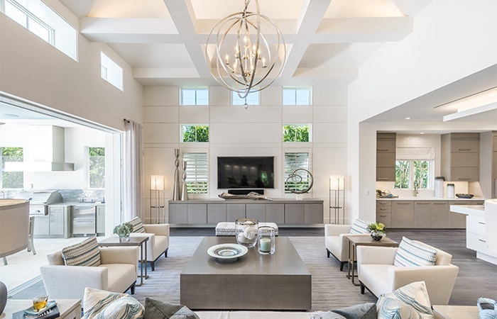 The coastal contemporary design in the Watlington complements its Old Naples location.