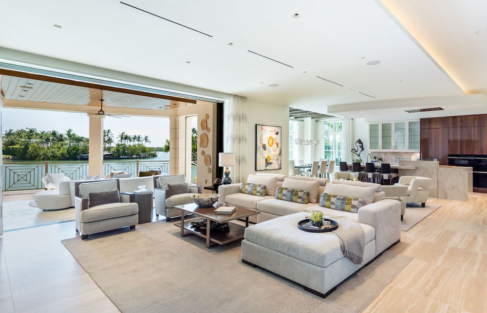 a stunning contemporary design boasting elegance in the large great ream with two sitting areas designed for evening gatherings of cocktails and conversations while taking in the sunset