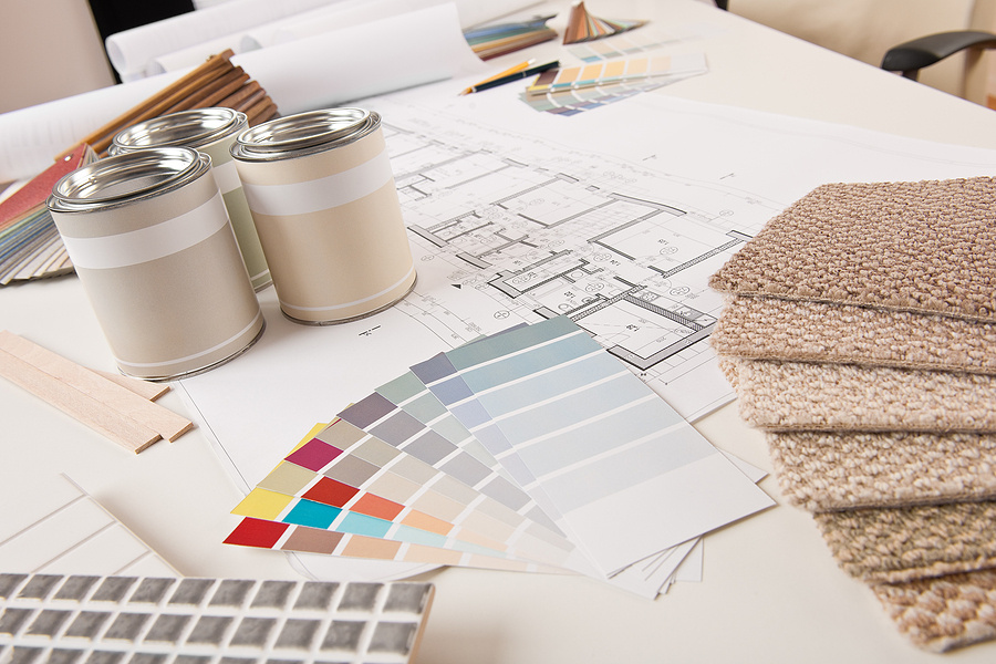 paint and carpet sample cards laid out on a table